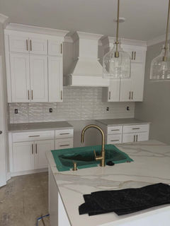 Modern kitchen, white cabinets, ceramic tile, stone island