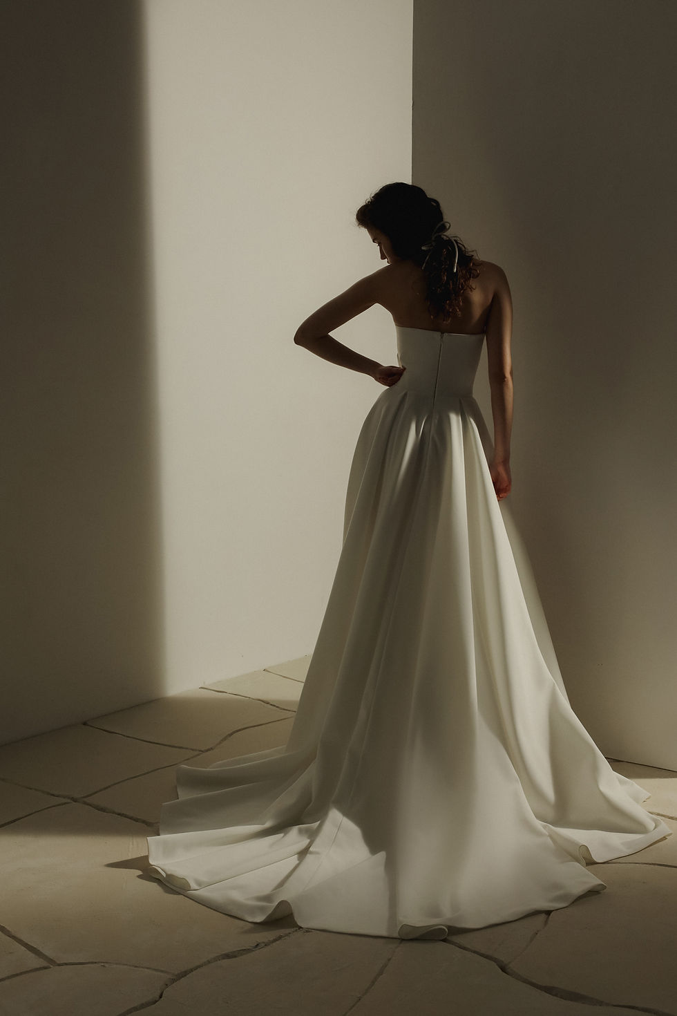 Thumbnail: Back of Norwin strapless aline wedding dress from Eva Lendel available in Ireland at Zadika Bridal