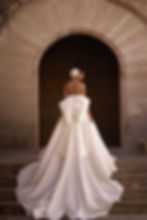 Lawrence mikado satin wedding dress by wona concept with sculpted pleat bodice, a knotched neckline with full skirt and bow