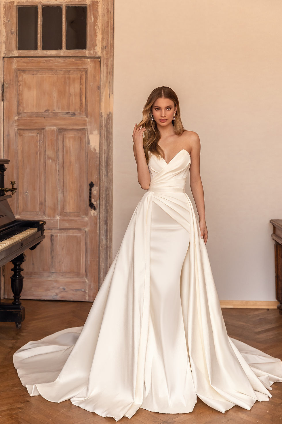 Thumbnail: Eva Lendel Lika minimalist satin wedding dress with overskirt available in Ireland at Zadika Bridal