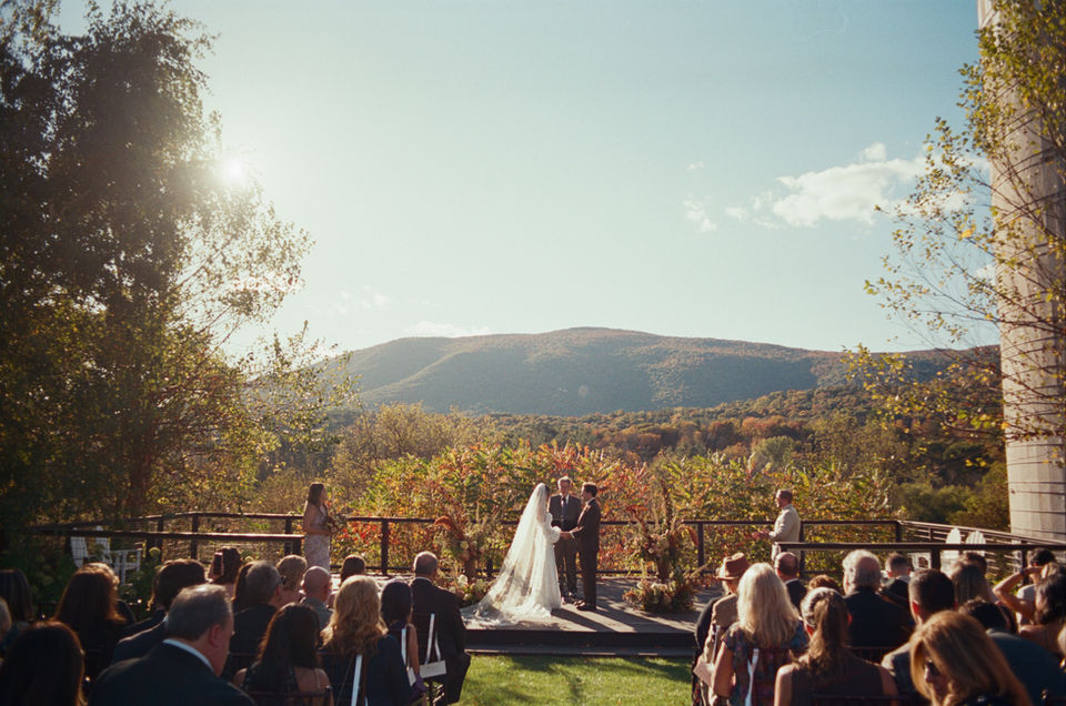 Ceremony on platform deck with Vermont mountains in the background