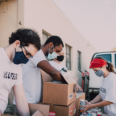 Volunteers packing boxes.