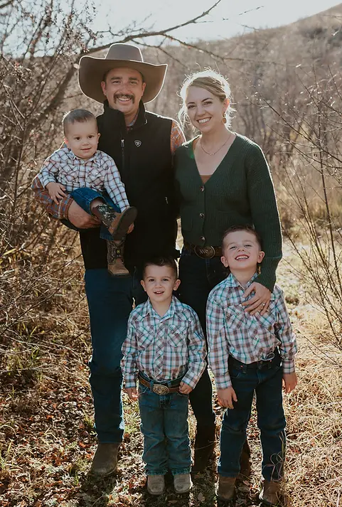 A family photo of the breeders with their children