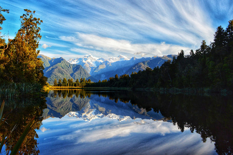 Lake Matheson in New Zealand stunning landscape photo of the reflective lake, mountains and forest