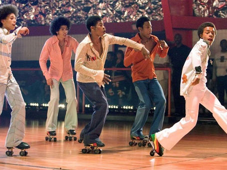 a group of men roller skating