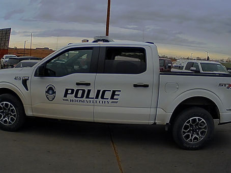 A car gets stopped driving through Roosevelt with no lights on