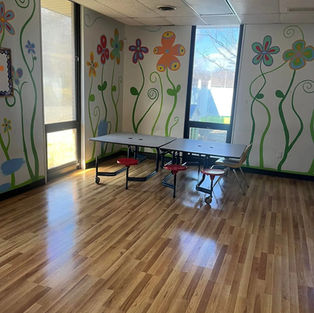 clean office floor with colorful flowers painted on the walls