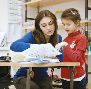 Teacher Helping Student