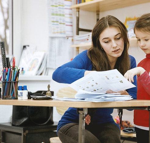 Teacher Helping Student