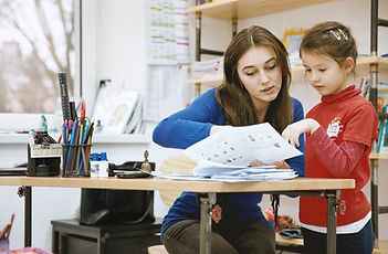 Teacher Helping Student