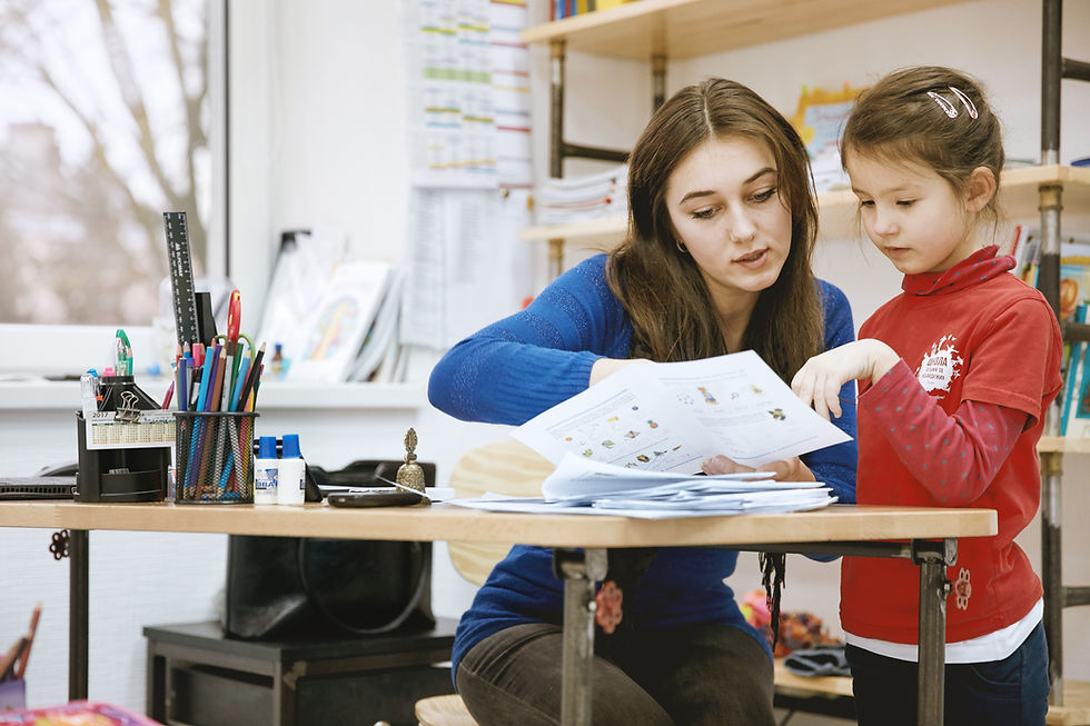 Teacher Helping Student
