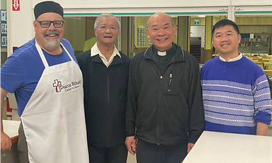Deacon Rick with Fr. Matthew and His Family.png