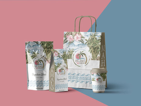 Tropical-themed Island Brew packaging set including coffee bags, a paper bag, and a cup with palm trees, hibiscus flowers, and island scenery.