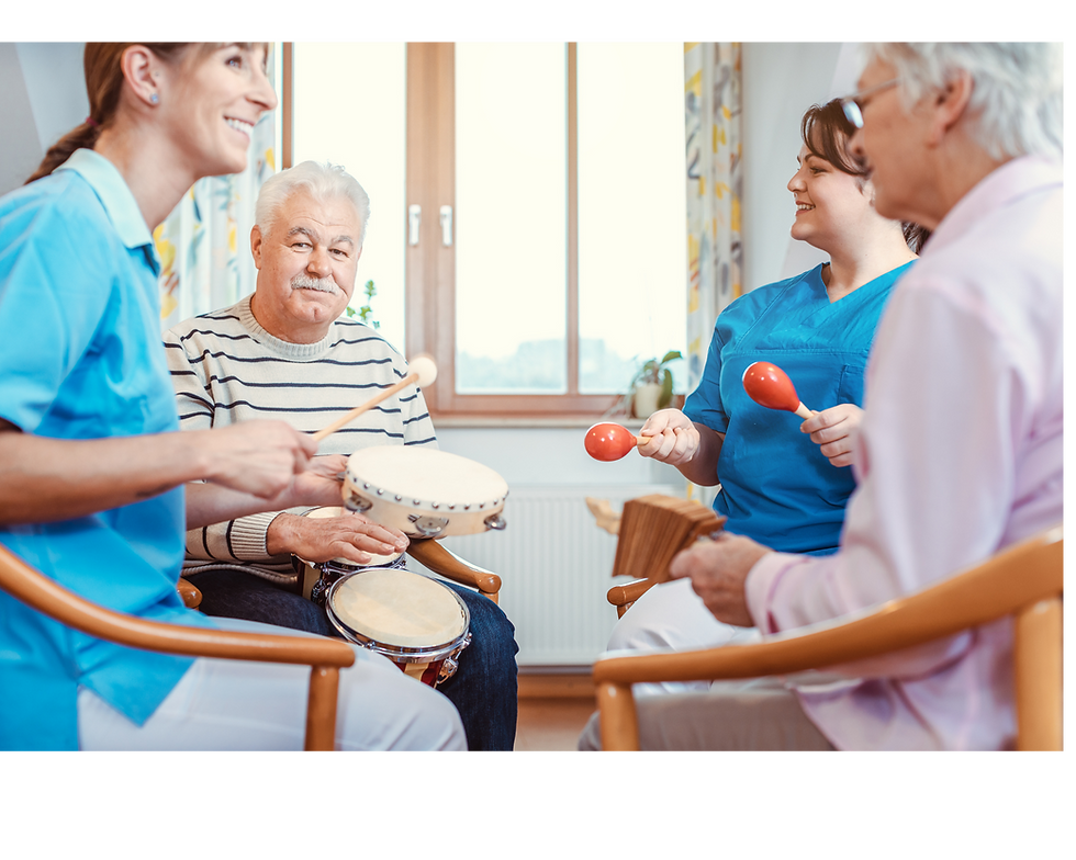 Seniors enjoying music therapy with caregivers