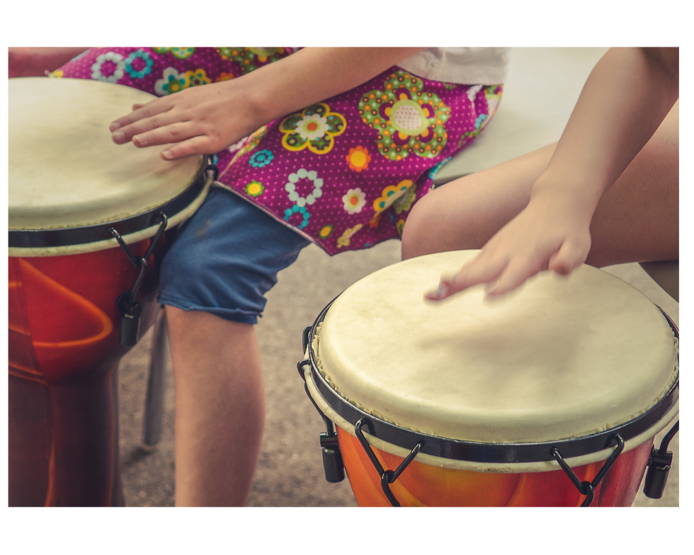Children playing drums during group music therapy