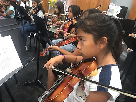 kids playing violins.jpeg
