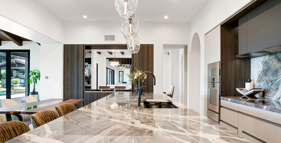 Architectural kitchen materials combining wood and matte glass.