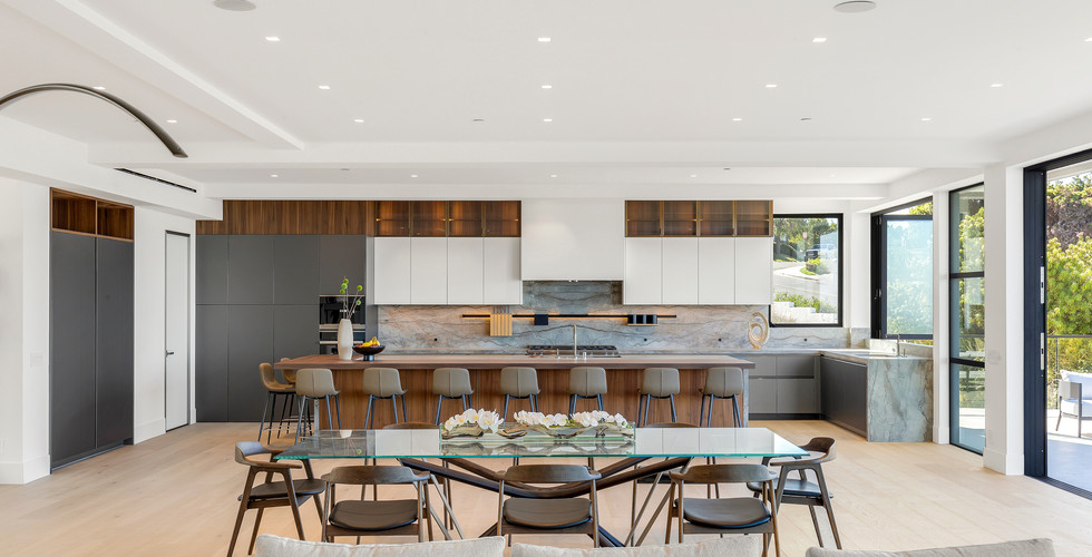 Luxury German kitchen design with warm-toned cabinetry and large island.