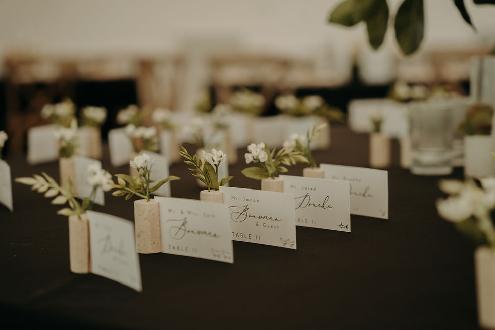 Wedding reception table styling with candles and layered place settings