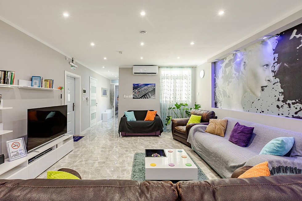 Bright, softly focused interior with light-colored furnishings and blue accents