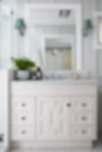 Classic bathroom designed by Porch Light Interiors in Brisbane with custom cabinetry , bespoke door profile design, silver tapware, marble bench top, wall sconces with custom shades