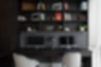Classic contemporary office design by Porch Light Interiors in Brisbane featuring built in shelving and storage, wallpaper, upholstered office chairs, metal mushroom lamp and decorated display