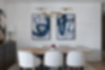 Classic contemporary dining room designed by Porch Light Interiors in Brisbane featuring oak dining table, upholstered dining chairs, brass pendant light, abstract blue art