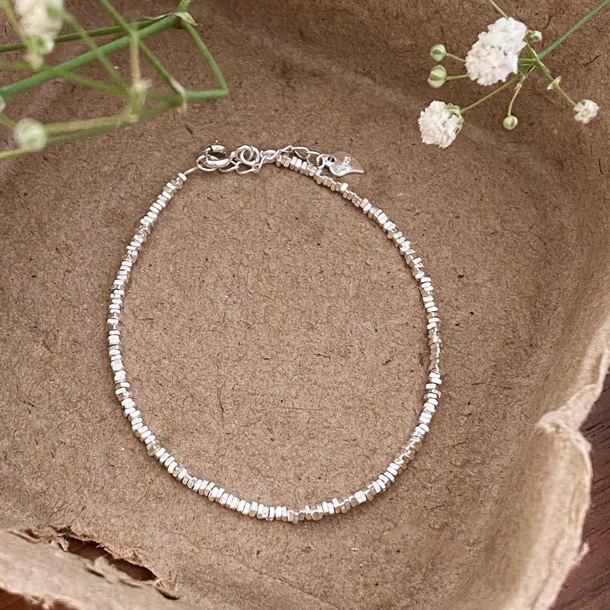 Sterling silver bracelet with triangle-shaped beads