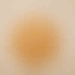 a wooden cutting board with a circular pattern on it