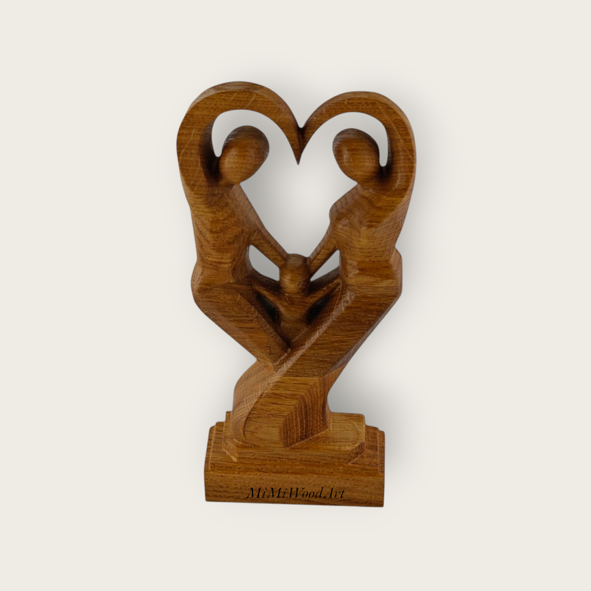 Abstract ash sculpture of family trio forming heart. Family Unity Sculpture