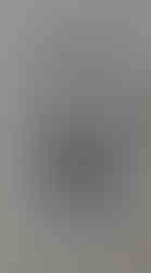 a black and white carving of a bearded man ,two swords