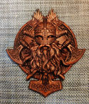 a wood carving of a man with a beard and a helmet