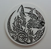 a black and white celtic design of a wolf in a circle