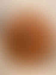 a wooden harley davidson clock on a tiled wall