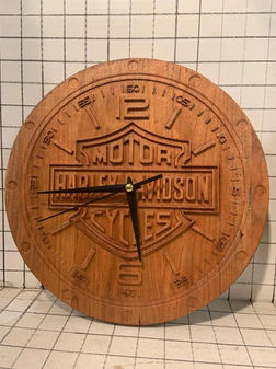 a wooden harley davidson clock on a tiled wall