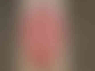 a wooden board with a sugar skull carved into it