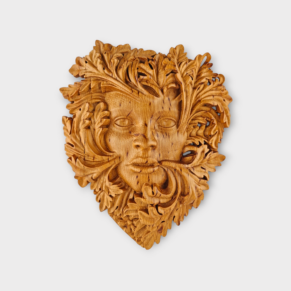 Birch wood carving of forest spirit woman face surrounded by leaves wall art
