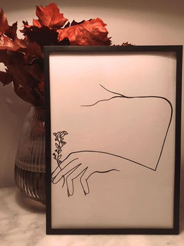 a drawing of a hand holding a flower next to a vase of flowers .
