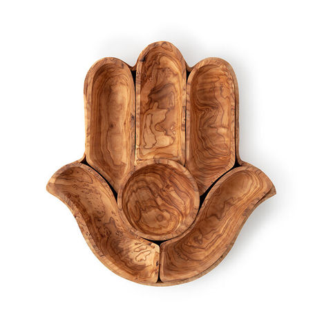 a hamsa hand shaped wooden tray with a bowl in the middle