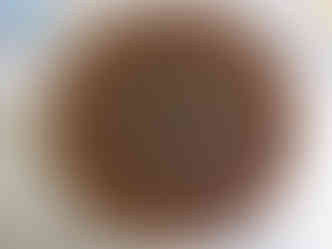 a wooden plaque with a compass and runes on it