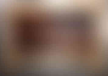 a wood carving of a fish with a hook in its mouth