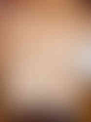 a wooden plaque with a heart and hands carved into it .