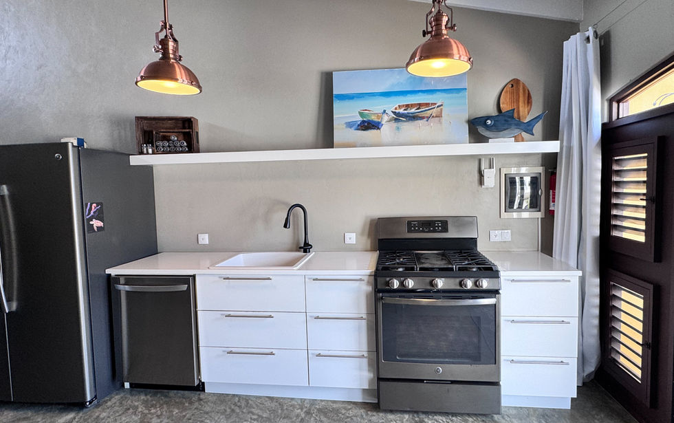 Fully equipped kitchen with gas range, dishwasher and full size fridge with water and ice dispenser.