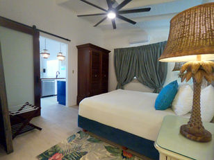 Kas di Almendra Bedroom with ensuite bathroom and outdoor shower.