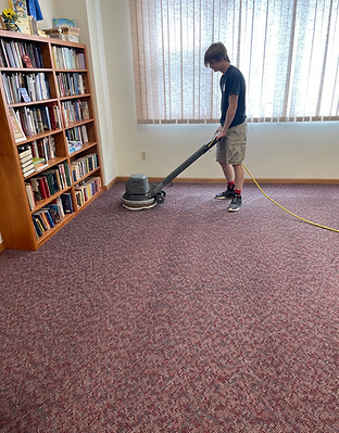 Heaven's Best Technician cleaning carpet with low moisture process