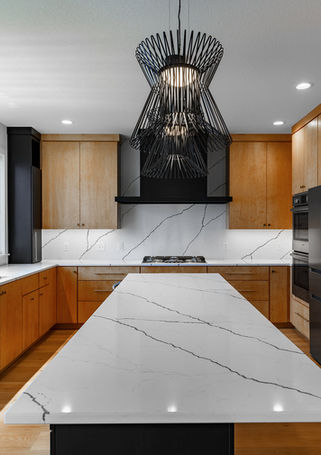 Custom kitchen, light maple stain and black paint. Slab doors.