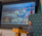 ABOVE: Susan Henderson discusses the comparison between the rebuilding of Ukraine and the city of Jelgava. Its former market square, destroyed during WWII, is shown in the slide.