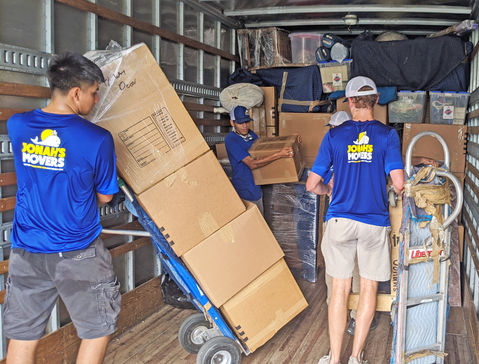 Picture of Loading Boxes onto the Moving Truck on a Dolly