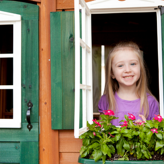 little girl in play house