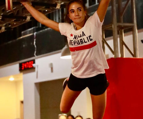 Child jumping between obstacles at Ninja Republic indoor ninja gym in San Mateo, CA
